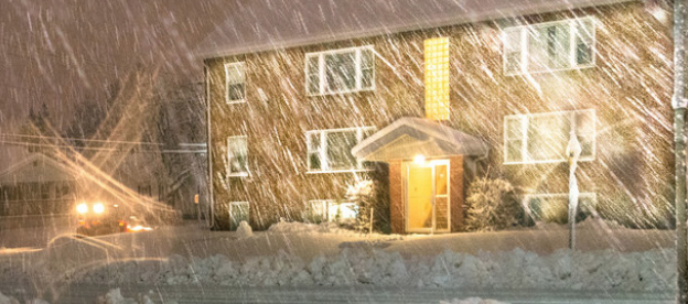 house in sleet and snow